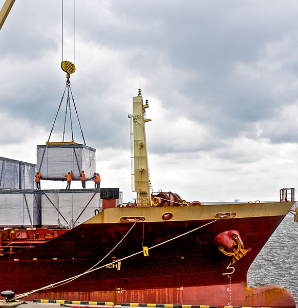 loading cargo into the ship in harbor